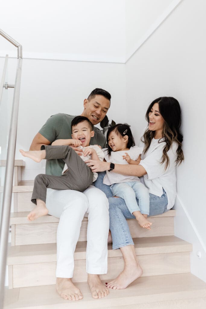 Family of four outfit inspiration for light and airy in-home family photos in Vancouver