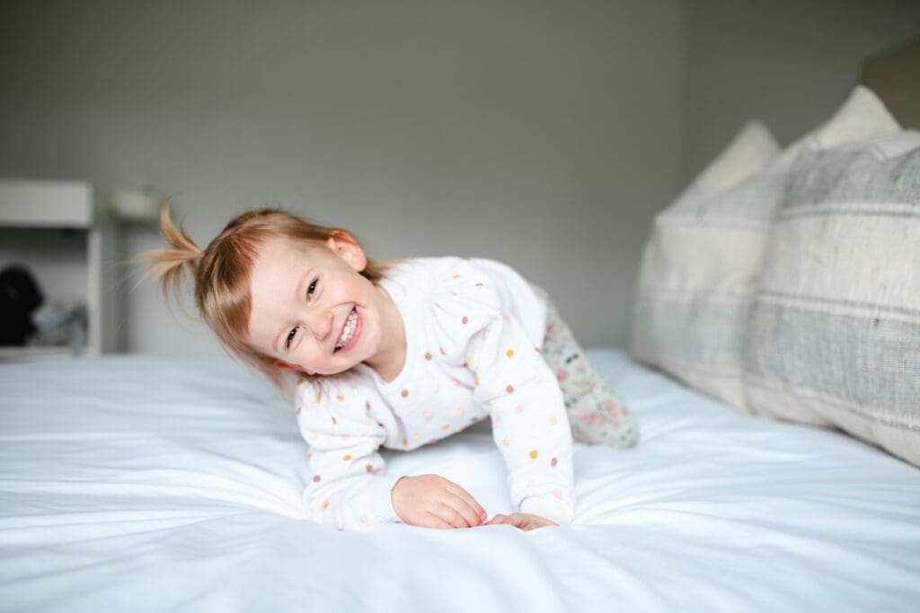 In-home photo showing toddler in neutral outfit that works well for lifestyle family photography