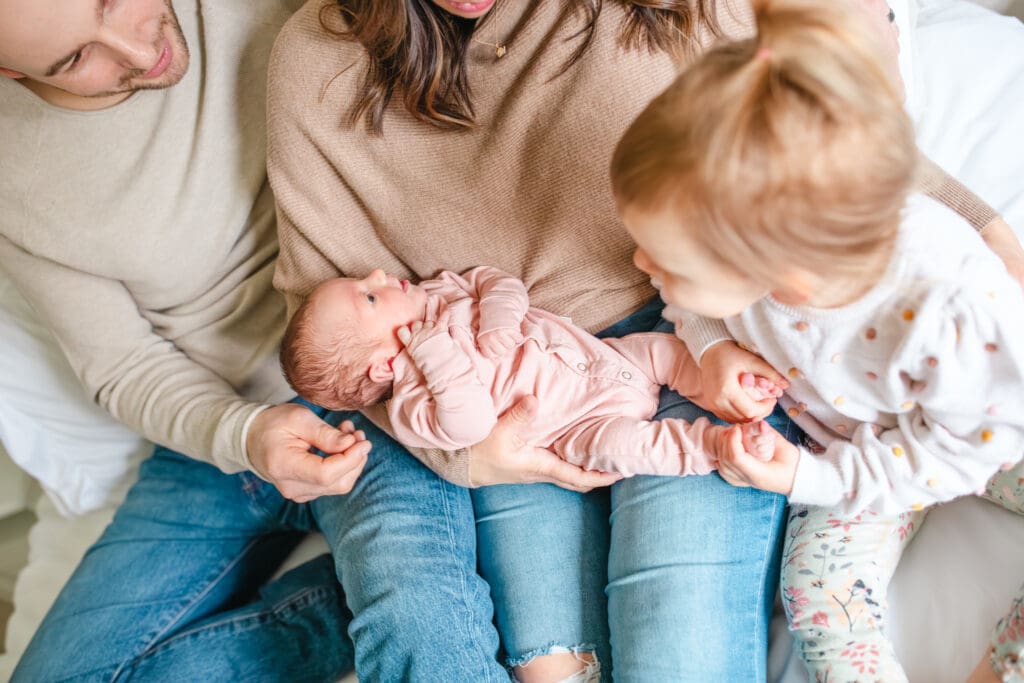 Children wearing soft, neutral clothing for in-home family photos