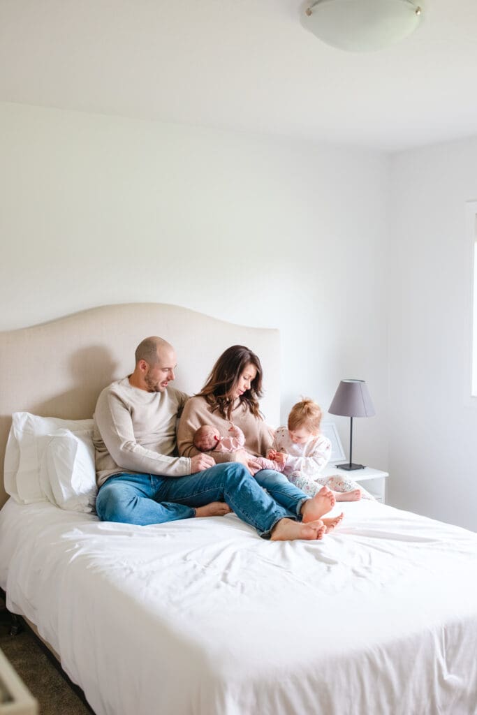 Parents and children wearing earth-tone outfits during a Fraser Valley family photo session