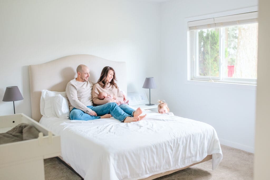 A calm, in-home lifestyle newborn session focused on connection, comfort, and real moments. These images capture a family exactly as they are — slowing down, settling in, and remembering the quiet beauty of the newborn season at home.