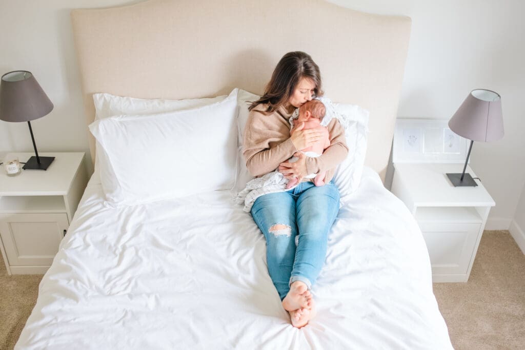 Mother and child wearing soft neutral outfits during an in-home family photography session