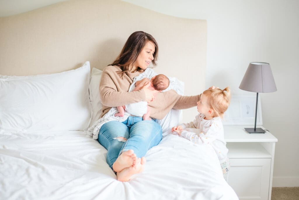 In-home newborn family session showing casual outfits that feel natural and relaxed