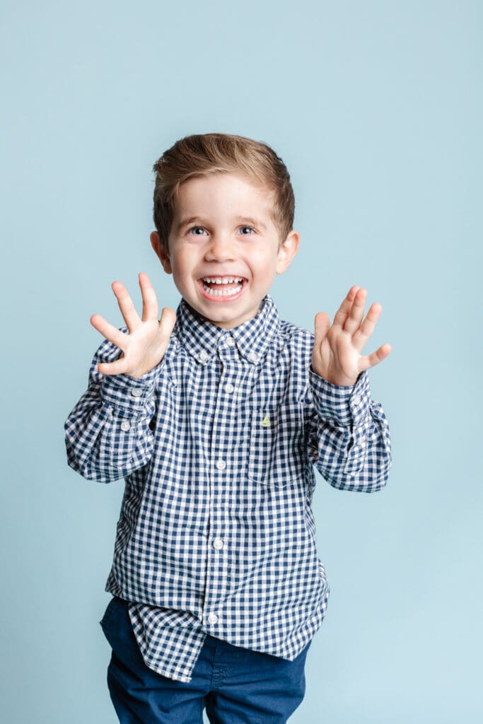Preschool photography session with relaxed, smiling child during daycare photo day