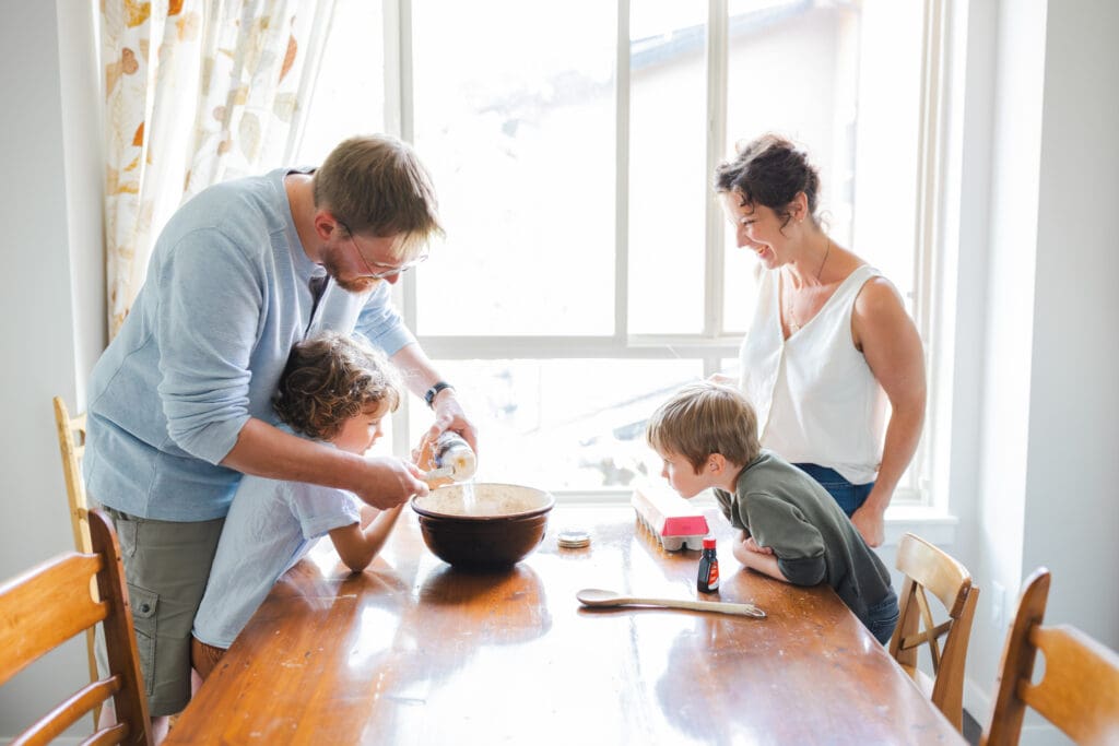 family baking together during documentary-style in-home family photography 