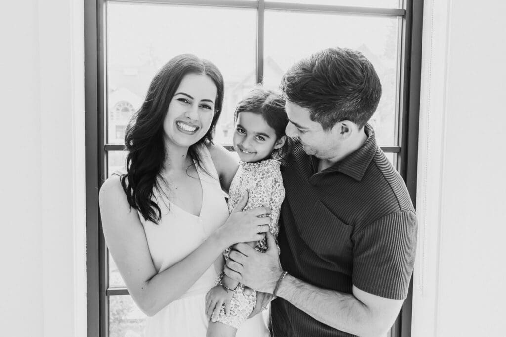 Family interacting with their child during a relaxed in-home family photography session in Vancouver.