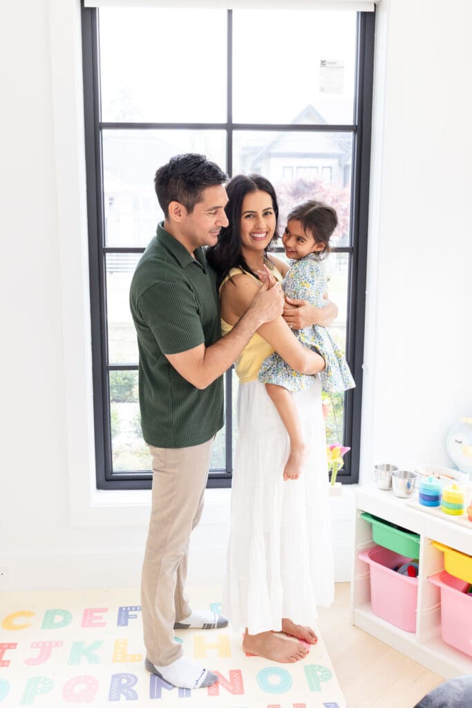Family interacting with their child during a relaxed in-home family photography session in Vancouver.