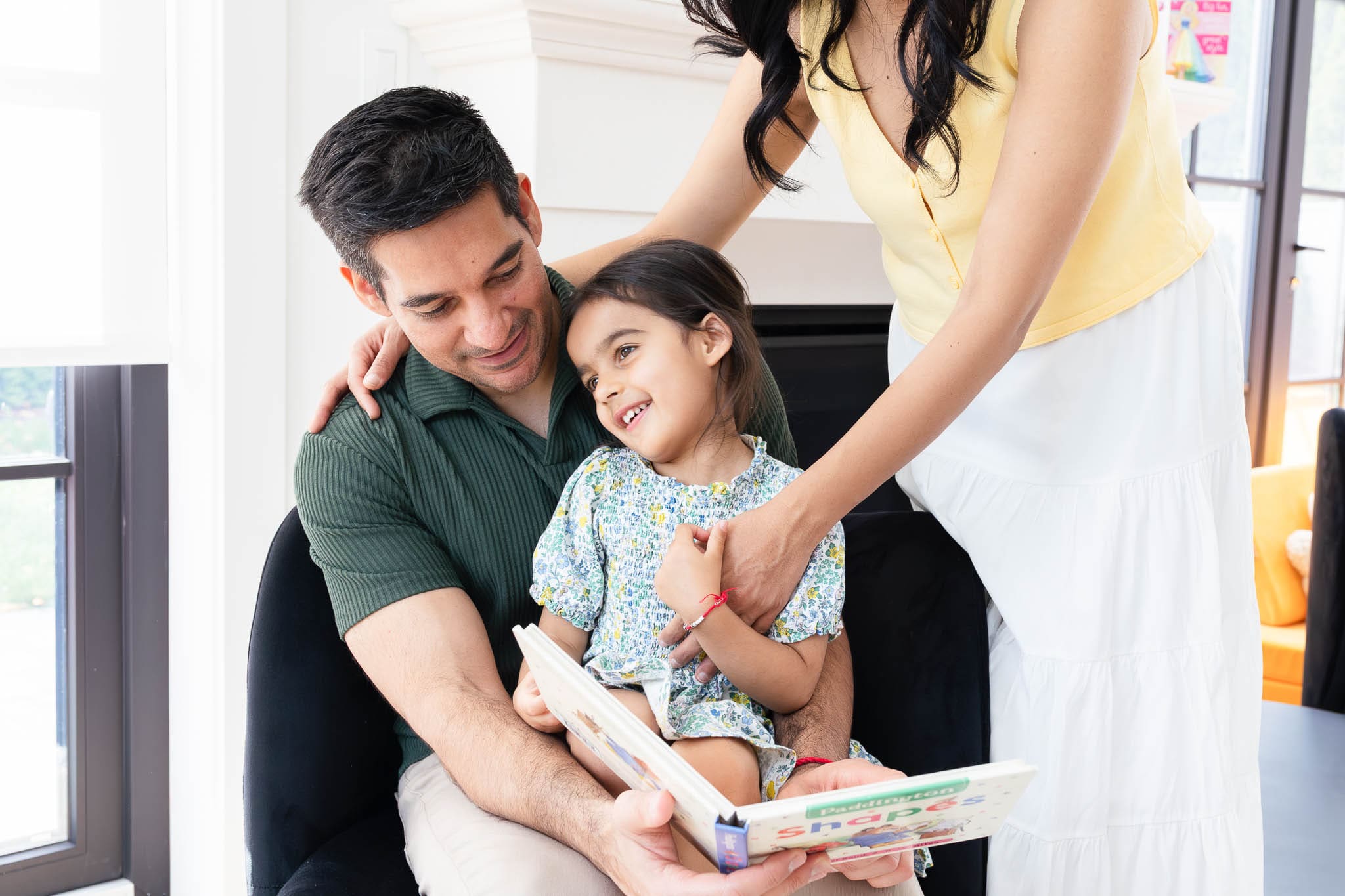 Playful child interacting during a lifestyle in-home family photography session in Vancouver.