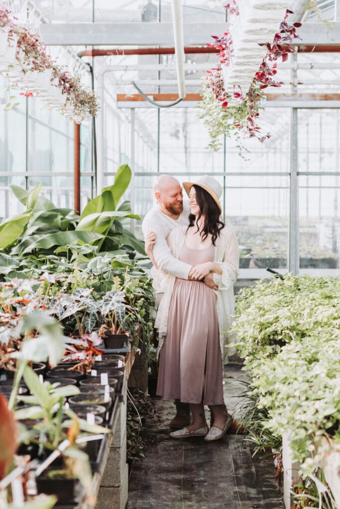 garden centre family photo of a husband and wife for couple's photos