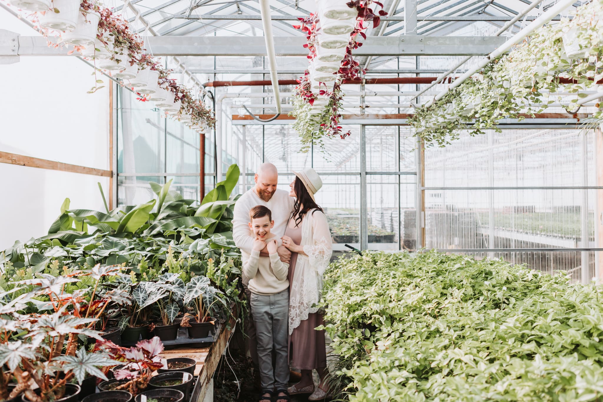 Lifestyle family photography session inside a bright Vancouver greenhouse