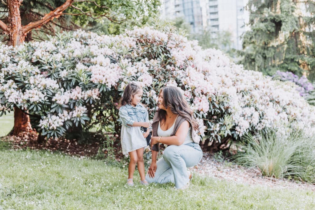 Mother and daughter wearing coordinated neutral outfits during outdoor Vancouver photo session