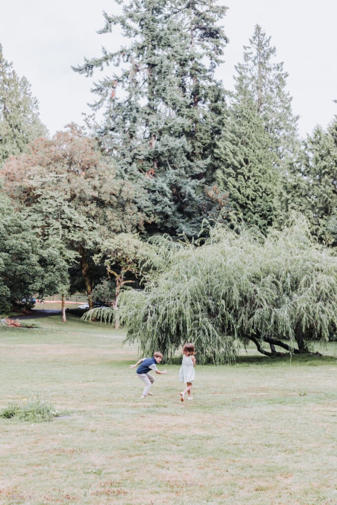 Brother and sister playing together at the Stanley Park Rose Garden