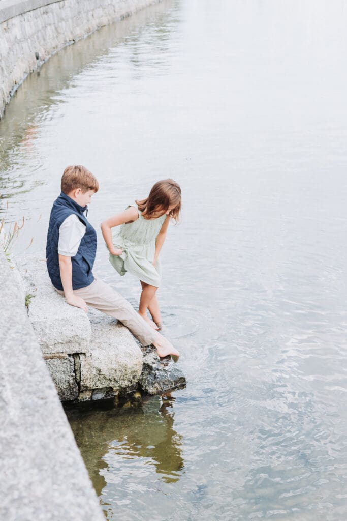 Children exploring the shoreline along the Stanley Park Seawall