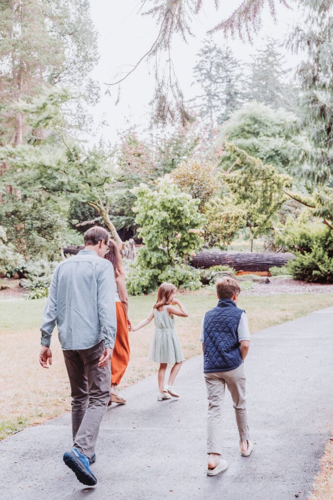 Family of four in the gardens at Stanley Park Pavilion in Vancouver