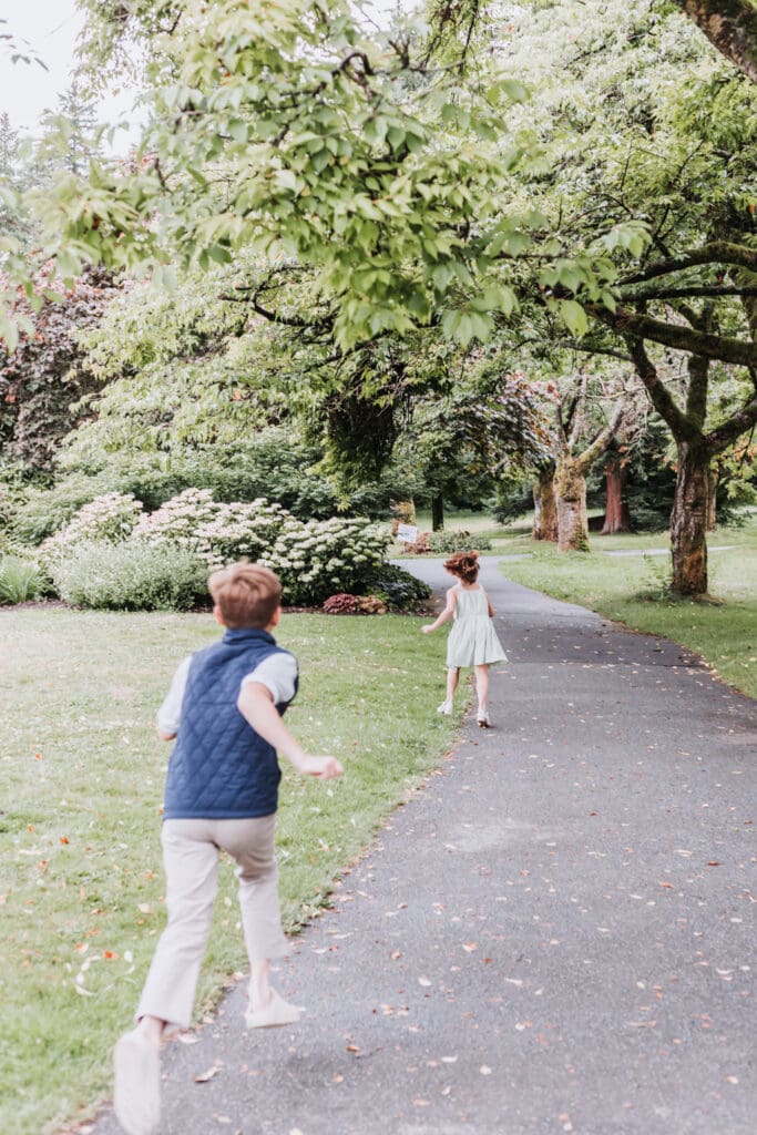 Brother and sister playing together at the Stanley Park Rose Garden