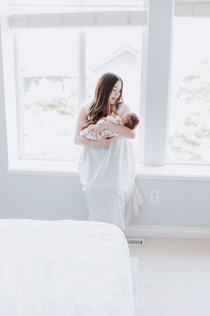 Light and airy newborn family photos in a Surrey home
