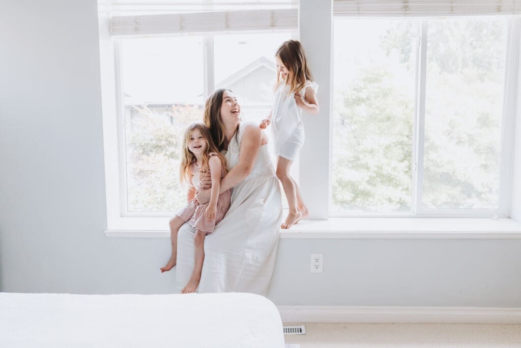 Light and airy newborn family photos in a Surrey home. Lifestyle family photos with toddlers