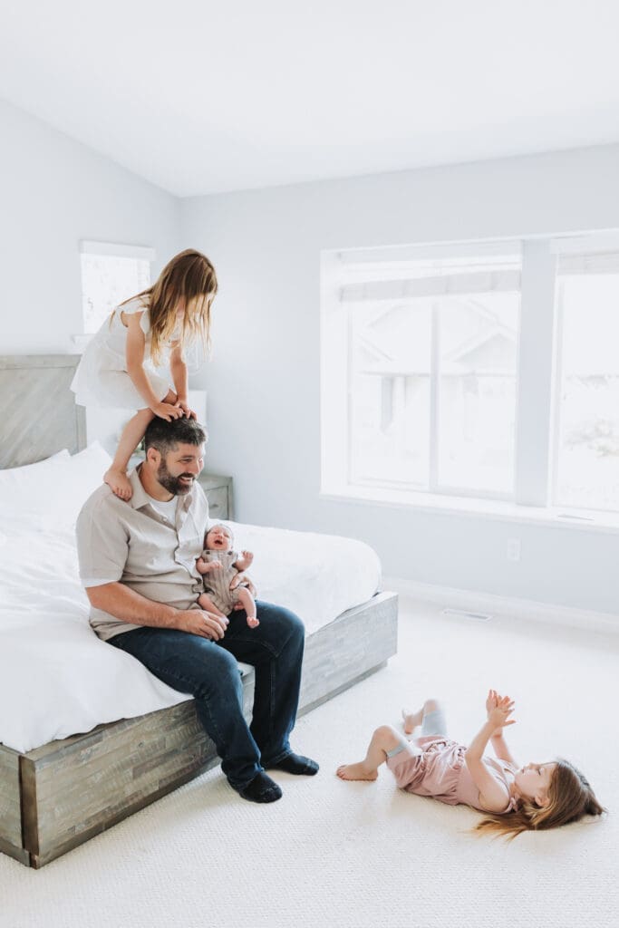 Light and airy newborn family photos in a Surrey home. Lifestyle family photos with toddlers