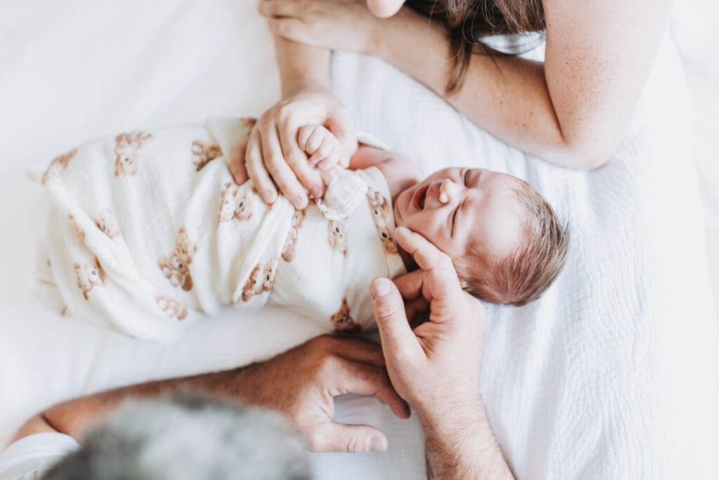 Light and airy newborn family photos in a Surrey home